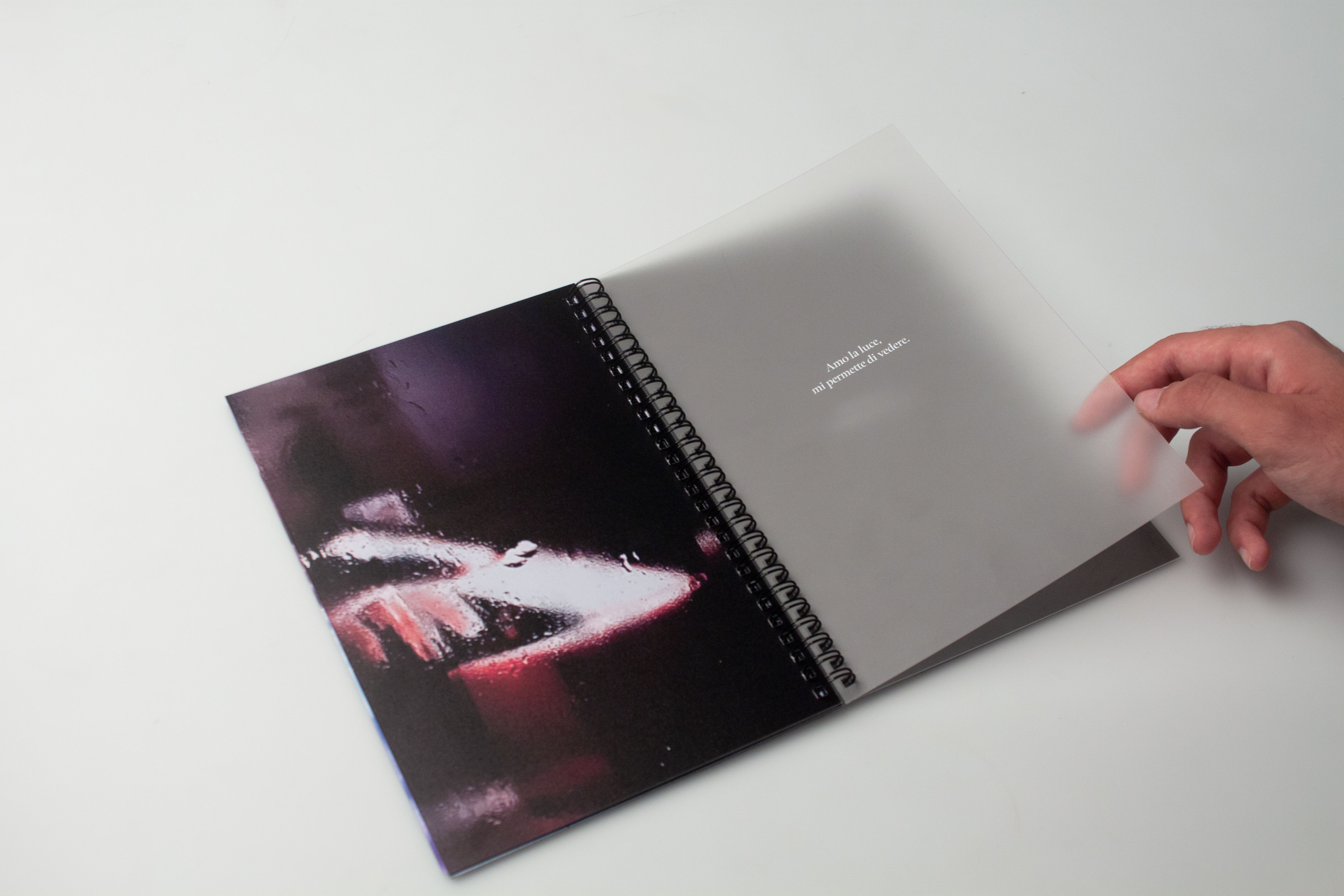 OLTRE — semi-transparent page over photograph